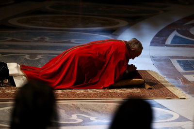 francis pope floor holy church feet lying prayer thursday pontiff praying god prostrate before peter vatican lord friday lay during