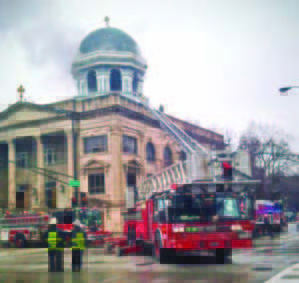 Fire trucks blocked Ashland Avenue as firefighters put out the blaze at St. Basil’s Greek Orthodox Church. (Photo by Carol Scherer)