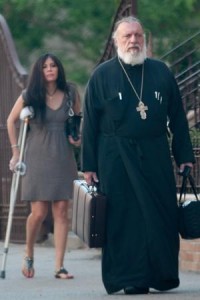 Pastor George Passias leaves St. Spyridon Greek Orthodox in Washington Heights with his assistant and “spiritual goddaughter,” Ethel Bouzalas.  Photo: J.C. Rice (New York Post).