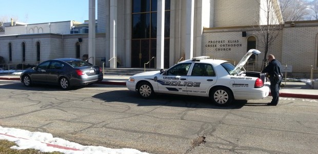 Police officers are stationed outside of the Prophet Elias Church in Salt Lake City.