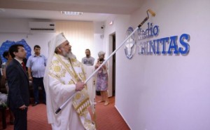 A church spokesman told local media that Patriarch Daniel was using a 'sanctification rod' not a paint roller