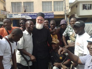Fr. Themi with young men of Freetown.