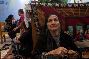 Farida Pols Matte, 80, in Ankawa, Iraq, with her family and other Iraqi Christian refugees. They are among the hundreds of thousands of people displaced by the Islamic State in Iraq and Syria. Credit Lynsey Addario for The New York Times