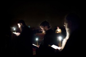 Monks in candlelight