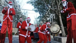 A band of Santas performing on the streets of Nazareth. Photo by Gil Eliahu