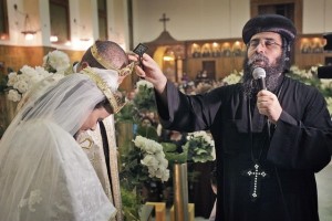 In this 2010 photo, a Coptic priest weds a couple at the Virgin Mary Coptic Church on the island of Zamalek in Cairo, Egypt. Ben Curtis/AP Photo