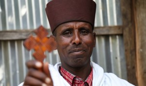 Priest Melak Birhan Ewenetu Yetemegne in the town of Debre Markos, Ethiopia. Credit: Colin Cosier