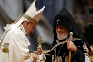 Pope Francis, left, is greeted by Karekin II, head of the Armenian Apostolic Church, at a mass on Sunday. PHOTO: GREGORIO BORGIA/ASSOCIATED PRESS