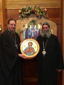 Bishop Suriel presents an icon in the Coptic tradition to Fr. John Behr.