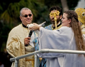 Courtesy of Lekkas PhotographyFather Anastasios Gounaris, left, watches as Theodora Lialios releases the dove during the 109th Epiphany celebration in Tarpon Springs in January.