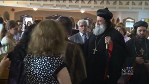 Morignatius Aphrem II greets members of the St-Jacques Syriac Orthodox Church in Laval on Sunday. PHOTO: CTV MONTREAL