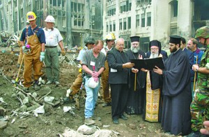 (RNS2-AUG23) Archbishop Demetrios of the Greek Orthodox Archdiocese of America, right (with gold vestments) leads a memorial service in 2001 at the site of the former St. Nicholas Greek Orthodox Church, which was destroyed by falling rubble from the World Trade Center during the 9/11 terrorist attacks. Attempts to rebuild the church have run into bureaucratic delays. For use with RNS-WTC-CHURCH, transmitted Aug. 23, 2010. RNS photo courtesy Dimitrios Panagos/Greek Orthodox Archidocese of America.