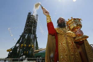 A Russian Orthodox priest conducted a ceremony in front of a Soyuz rocket at the Baikonur Cosmodrome in Kazakhstan in December 2015. Shamil Zhumatov/Reuters