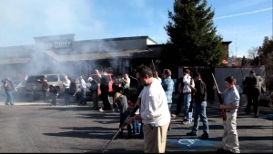 Christmas celebrants of all ages fire shotguns in front of Mel & Faye’s Diner, in Jackson. [Amador Ledger Dispatch file photo]