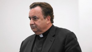 The Rev. James Dokos, shown in 2014, has reached a plea deal in his theft case, authorities said Feb. 10, 2016. (Abel Uribe, Chicago Tribune)