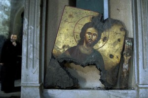 A half-burned image of Christ is placed next to a wall at a Greek Orthodox church in Maaloula, Syria, Thursday, March 3, 2016. Maaloula, an ancient Christian town 60 kilometers (40 miles) northeast of Damascus, changed hands several times in the war. Its historic churches pillaged by jihadis and buildings riddled with shrapnel reflect fierce fighting that devastated the town two years ago. (AP Photo/Pavel Golovkin)
