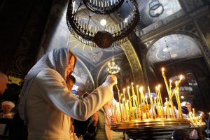 Worshipers light candles as they attend an Orthodox Easter mass in St. Volodymyr’s Cathedral in Kiev, Ukraine, April 11, 2015. PHOTO: NURPHOTO//ZUMA PRESS