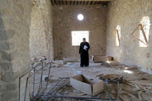 A Catholic priest inspects the damage at Mar Elian monastery in Al-Qaryatain, Syria, April 8. The town was recently retaken from ISIS by Syrian government forces. MAX DELANY/AFP/GETTY IMAGES