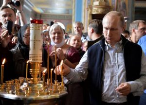 (Photo: Sputnik/Kremlin/Alexei Druzhinin/via Reuters) Russian President Vladimir Putin attends a religious service at the Cathedral of the Transfiguration of the Savior at Valaam Monastery, Russia, July 11, 2016.