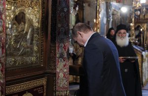 Russian President Vladimir Putin bows in front of an icon of Virgin Mary as he visits the church of the Protaton, dedicated to the Dormition of the Virgin, in Karyes, the administrative center of the all-male Orthodox monastic community of Mount Athos, northern Greece, Saturday, May 28, 2016. Russian President Vladimir Putin has arrived at the northern Greek peninsula of Mount Athos, on a visit to the autonomous Orthodox Christian monastic community. (Alexandros Avramidis/Pool Photo via AP)
